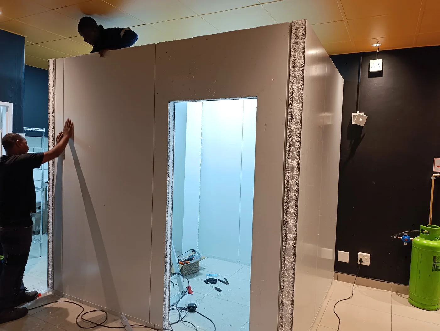 Technicians assembling insulated cold room panels at Bin Rashied Kenilworth