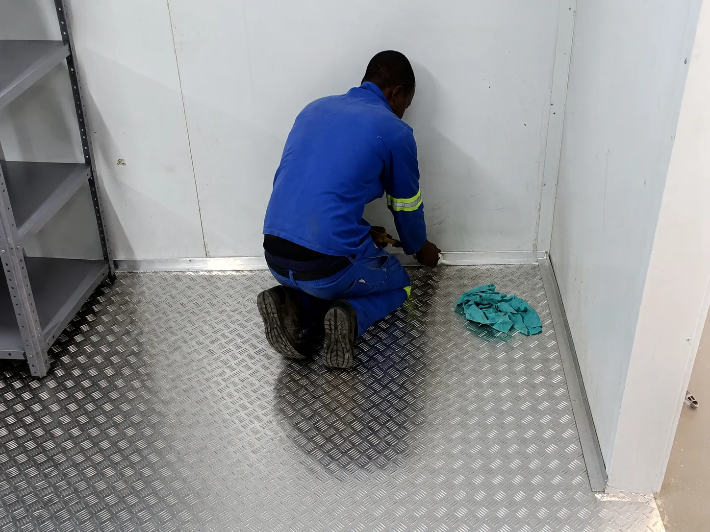 Cold room floor installation and doorway finishing work at Bruce Catering in Paarden Eiland