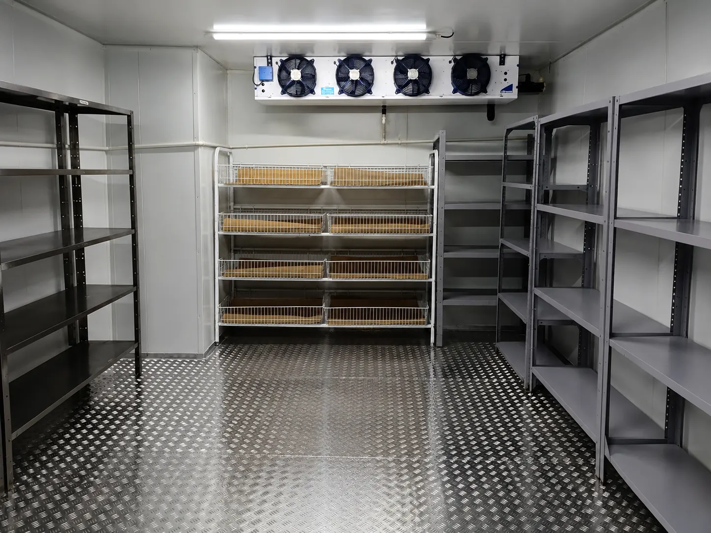 Completed insulated aluminium checker-plate floor inside Bruce Catering cold room in Paarden Eiland