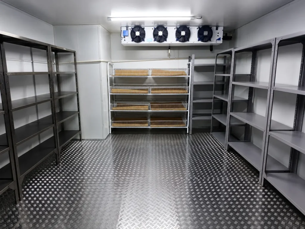 Wide interior view of Bruce Catering cold room with insulated aluminium flooring and storage shelving