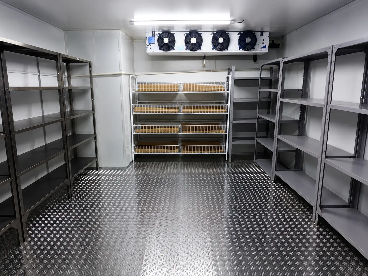 Wide interior view of Bruce Catering cold room with insulated aluminium flooring and storage shelving