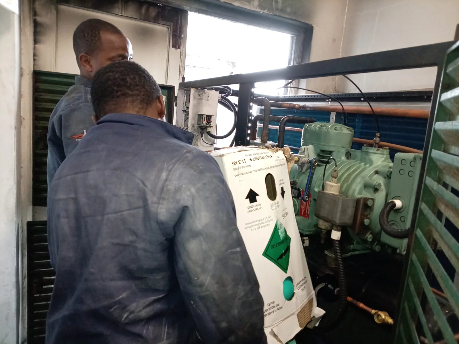 Technicians working on the condenser replacement project at Combined Abalone in Hermanus