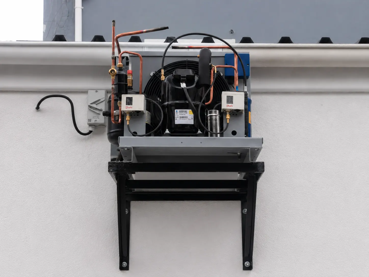 Commercial cold room condensing unit mounted on a steel wall bracket for Chingadas Mexican Cantina