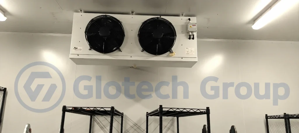 Commercial cold room evaporator unit installed above storage shelving
