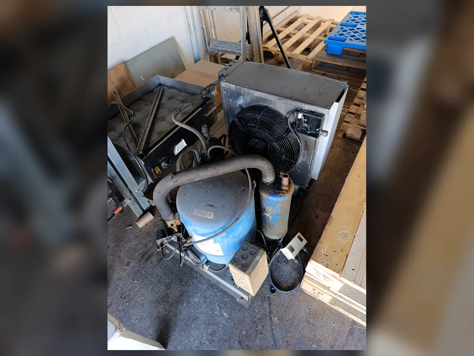 Old commercial refrigeration condensing unit before replacement
