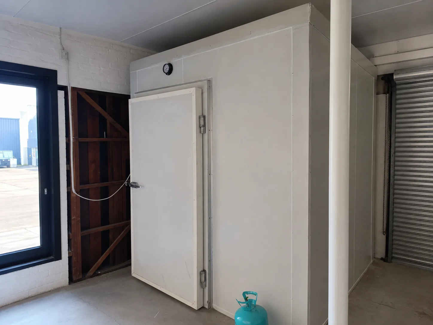 Completed walk-in cold room structure with insulated panels and cold room door at Bin Rashied Salt River