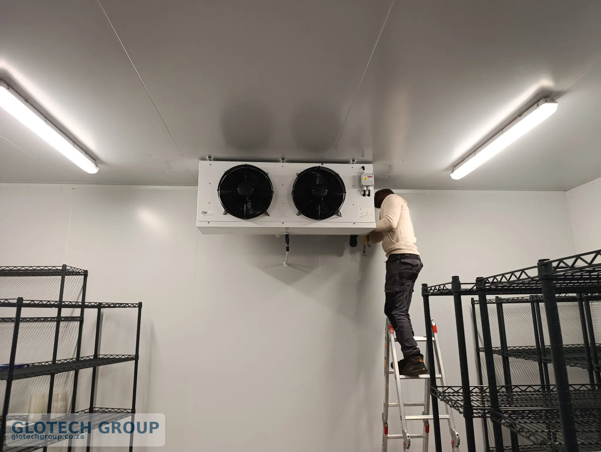 Final commissioning of the evaporator inside the Fall Creek Nursery cold room.