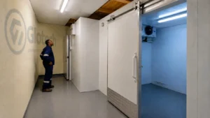 Technician inspecting walk-in freezer access at Milpark Meat Market in Milnerton