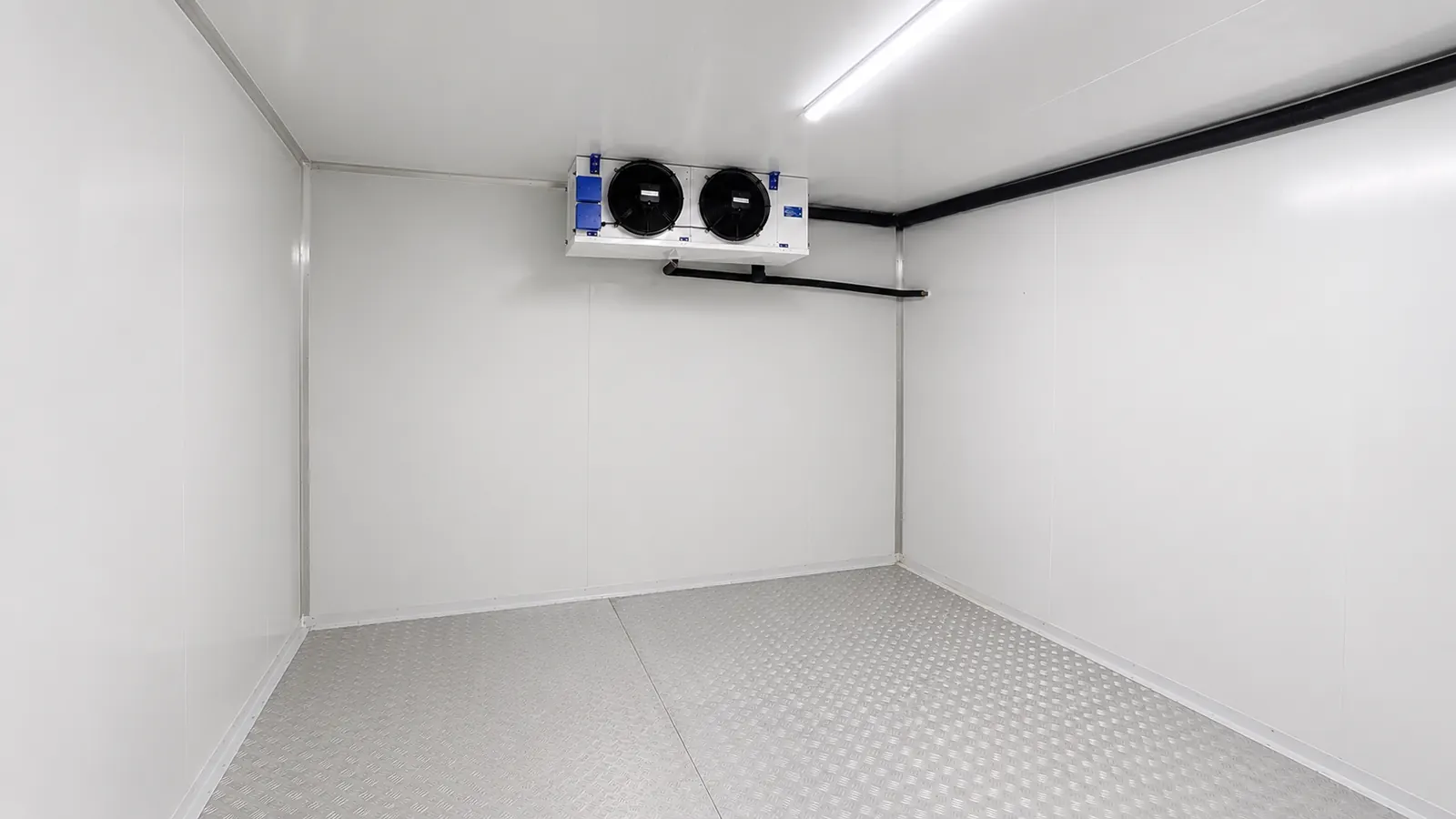 Completed walk-in freezer interior with insulated panels and aluminium floor