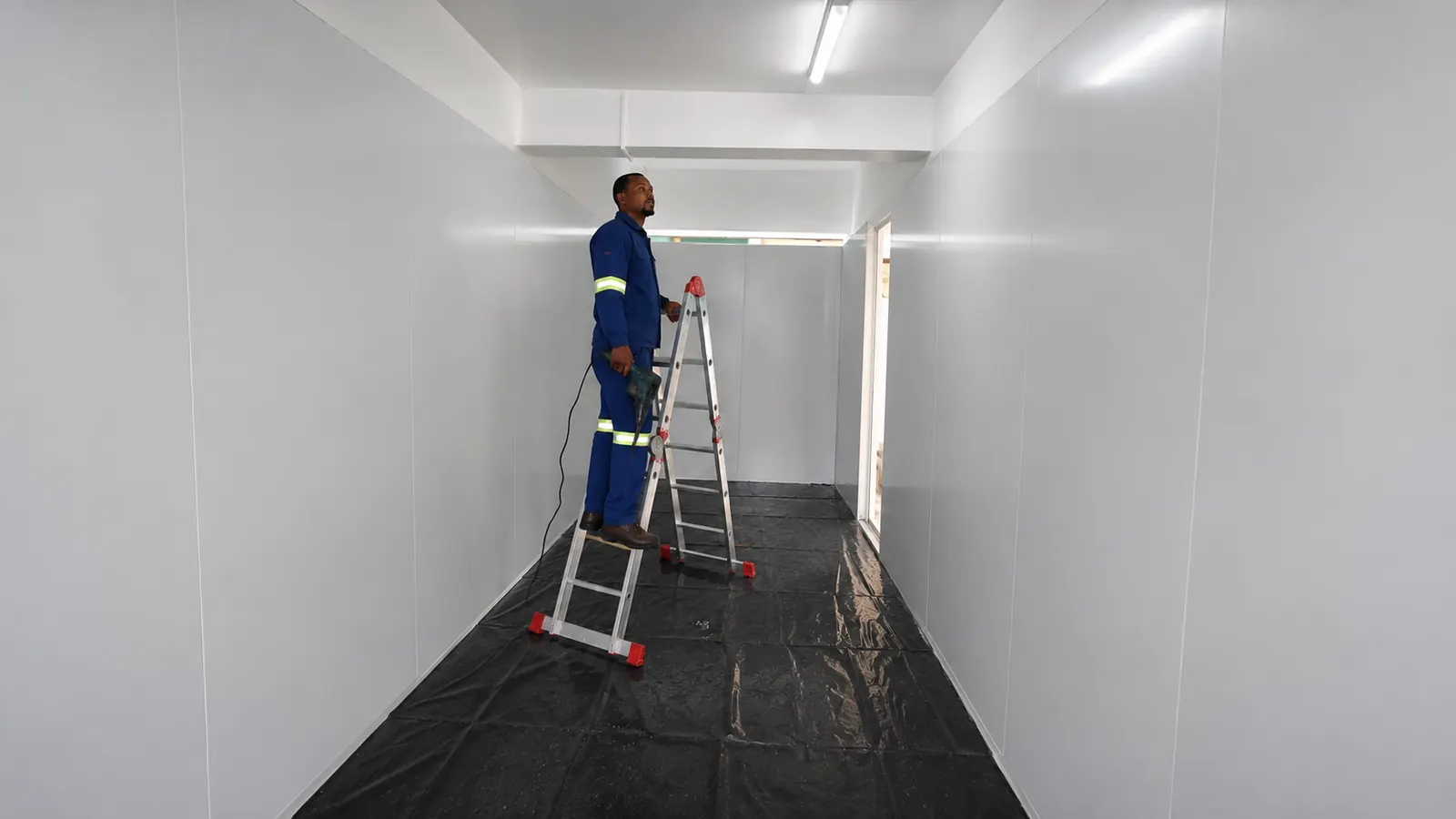 Technician completing a commercial walk-in freezer installation in Milnerton