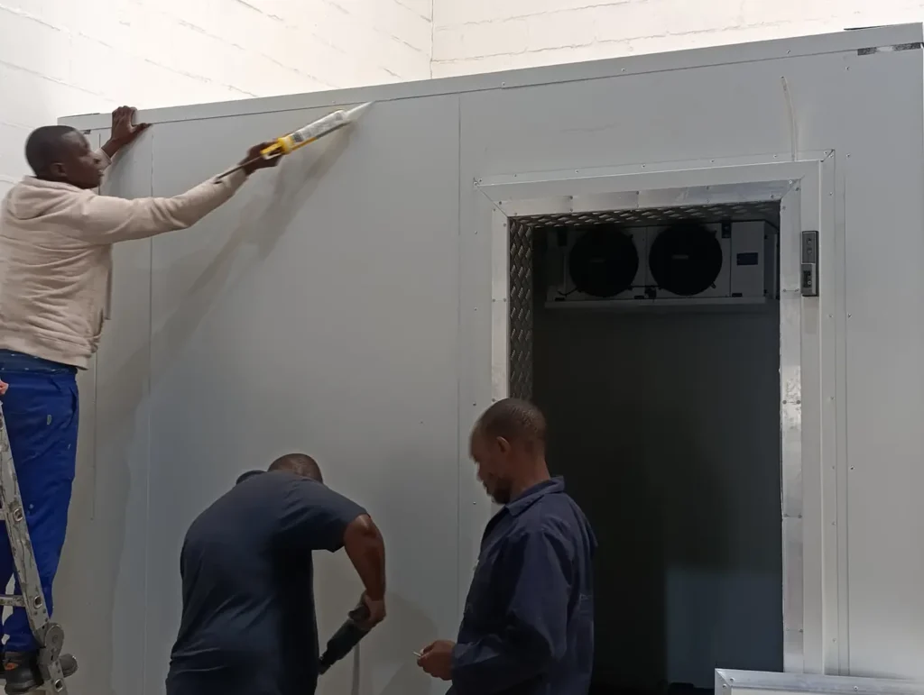 Commercial walk in freezer insulated panel installation during construction for Better Batters manufacturing facility in Parow Industria.