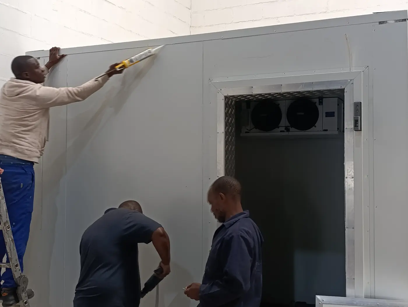 Commercial walk in freezer insulated panel installation during construction for Better Batters manufacturing facility in Parow Industria.