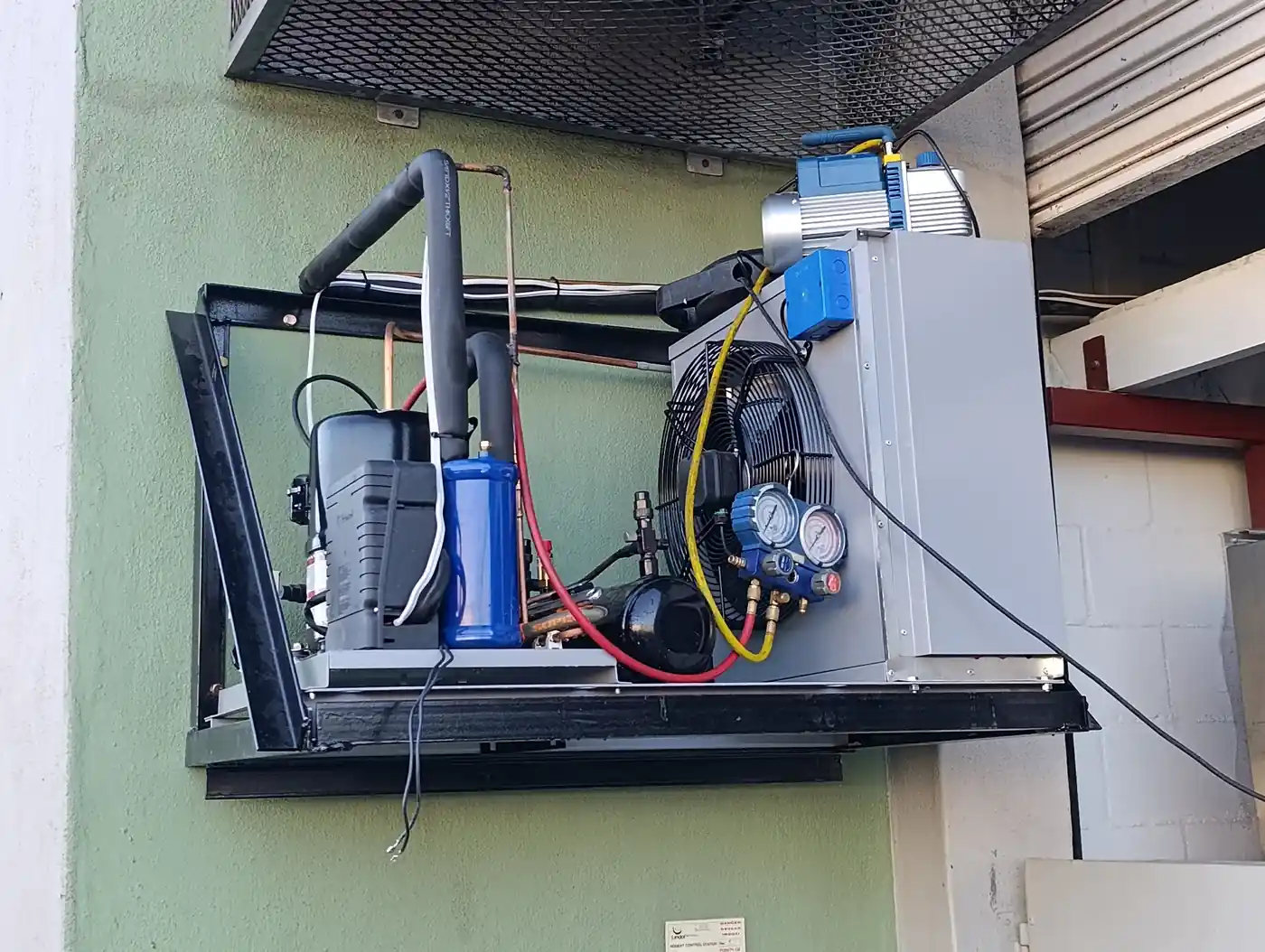 Commercial walk in freezer refrigeration system installation including compressor and condensing unit for Better Batters.