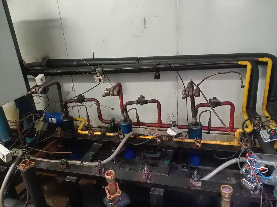 Compressor rack with units removed before replacement
