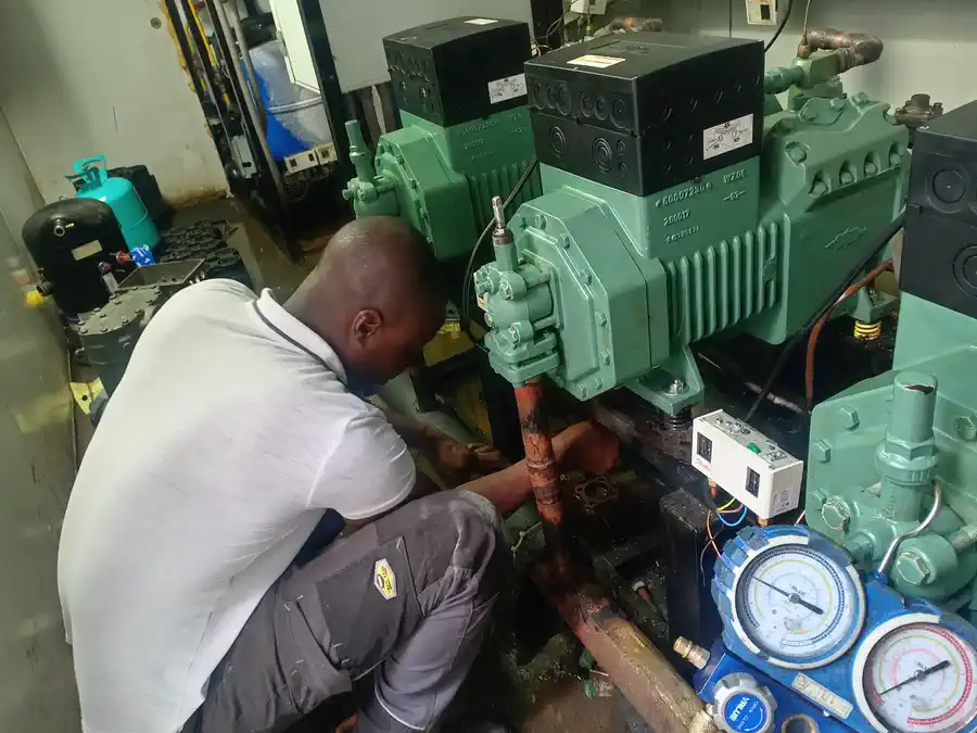 Technician installing a Bitzer compressor at Spar Wellington